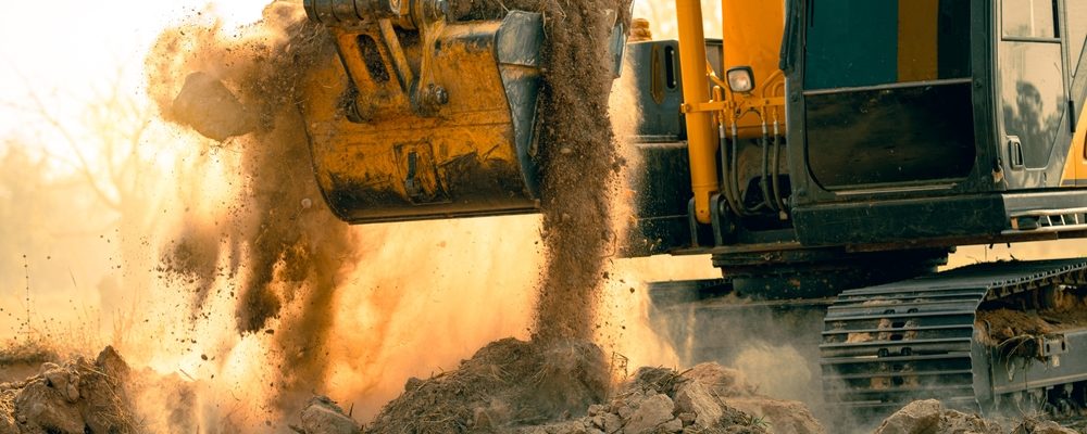 Close-up,Of,Excavator,At,Construction,Site.,Backhoe,Digging,Soil,For